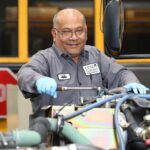 Mechanic fixing Bus